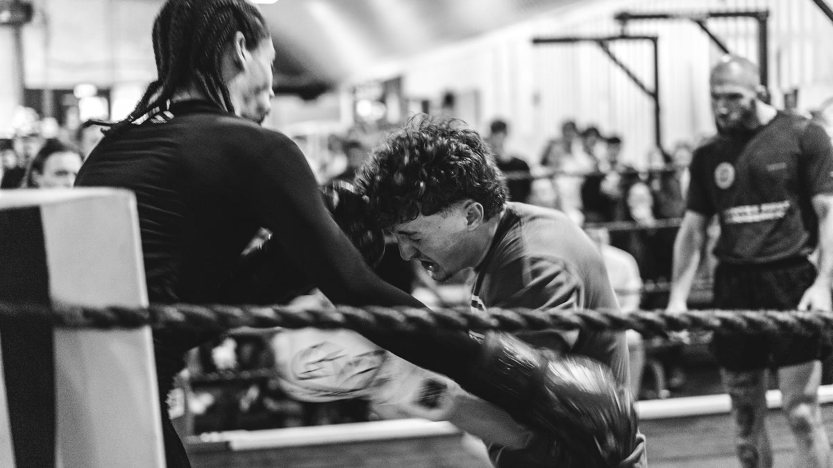 Boxer completing a controlled jab-cross and returning both hands to guard