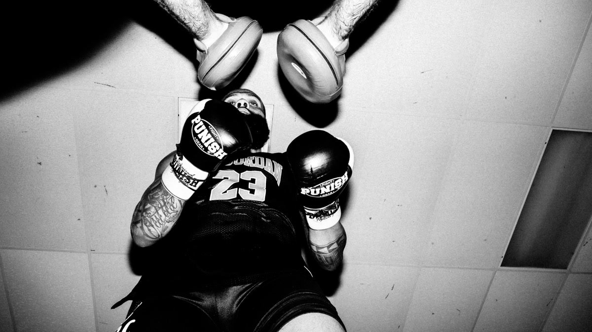 Beginner reviewing a boxing training note after a shadowboxing session
