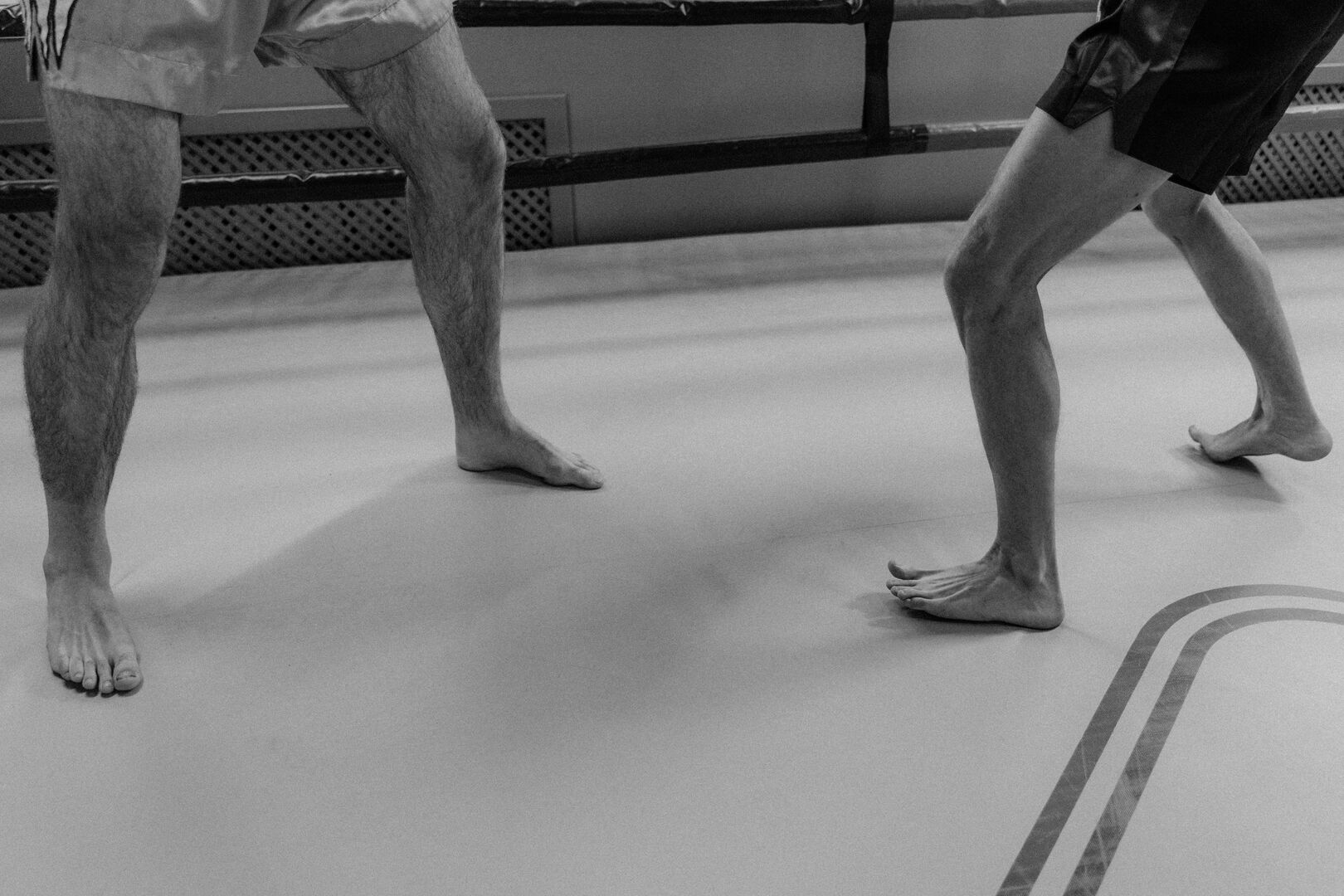 Boxing stance moving forward, backward, left, and right on a floor grid