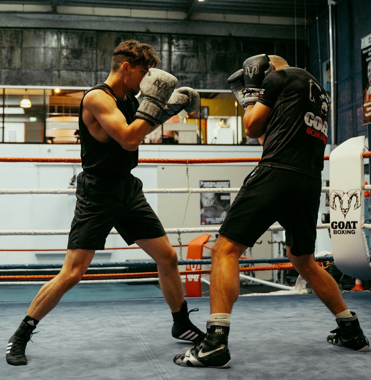 Boxer reacting to visual cues with a slip, parry, and step