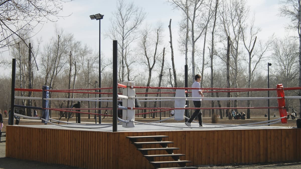 Beginner shadowboxing in a clear home training area with room to step safely